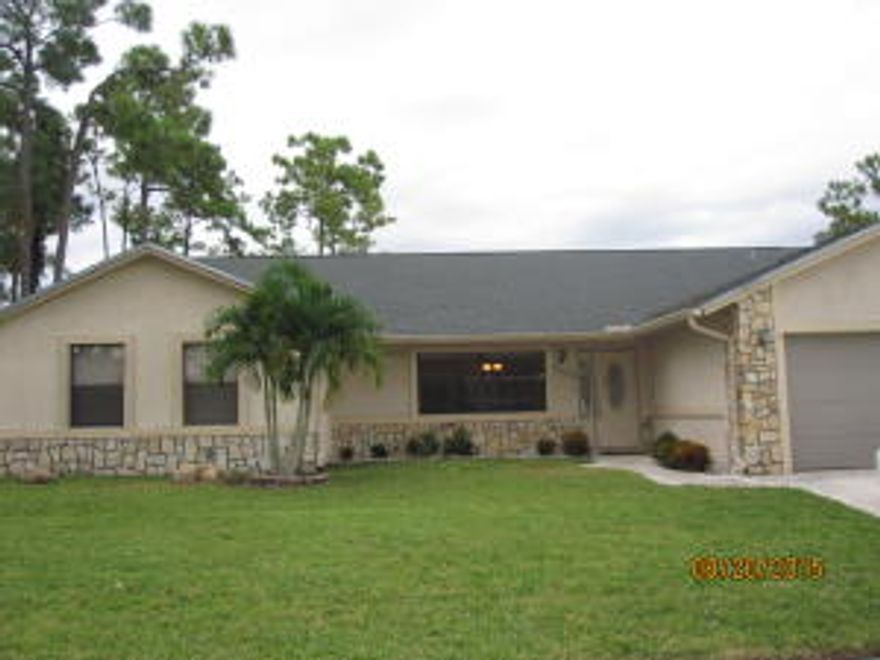 Spacious single family home in the heart of Wellington. The exterior is nicely landscaped in the front & features a private, fully fenced yard w/a screened in salt water pool & large patio area.2015 Pool Pump Motor. 2015 Sprinkler pump.The interior has a step down living room (currently used as a family room),separate formal dining room (currently used as an office) & a family area w/sliders to the patio & open to the large kitchen.Kitchen features a pass thru window to the patio, center island w/cook top, wall mount oven & Microwave, pantry, desk, eat-up bar & breakfast area w/patio access.Master bedroom features a Remodeled bathroom.2nd bath is a cabana bath. Large inside laundry room has plenty of storage & a wash bin.Home has alarm system w/multiple exterior camera