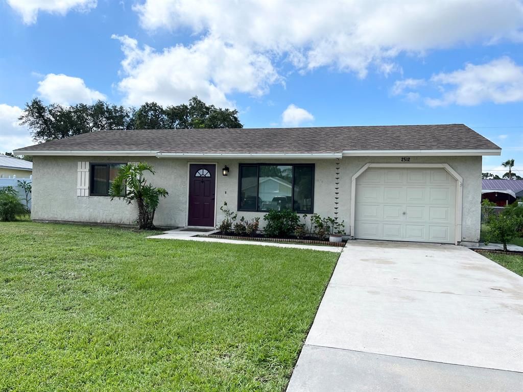 Photo of 2512 SE Calusa Avenue, Port Saint Lucie, FL 34952 (MLS # R10806408)