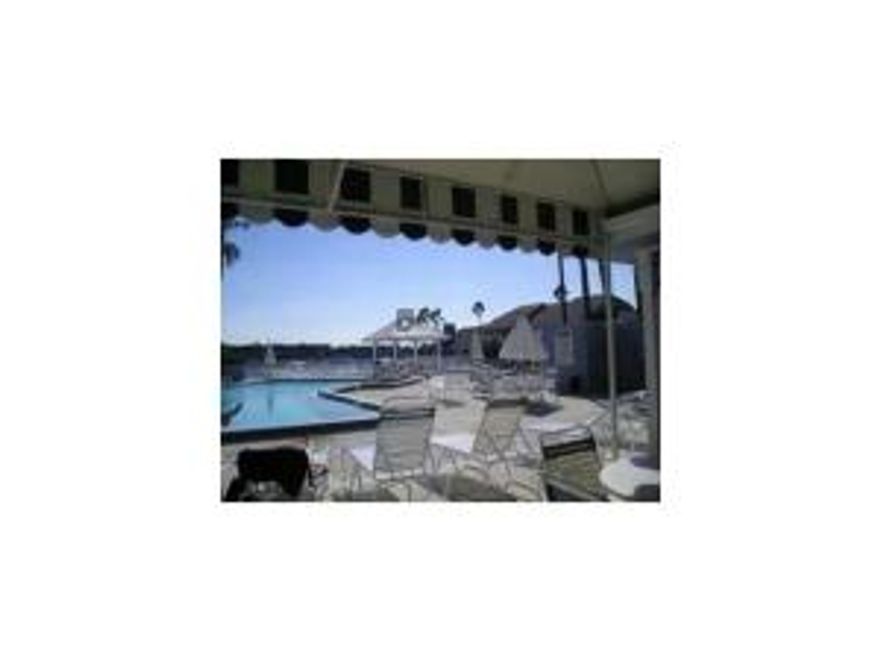 Great 2/2.5 townhouse with 1 car garage.  Walk to beach and shopping.  Couldn't be a better location in a gated community.  Long term lease an option.