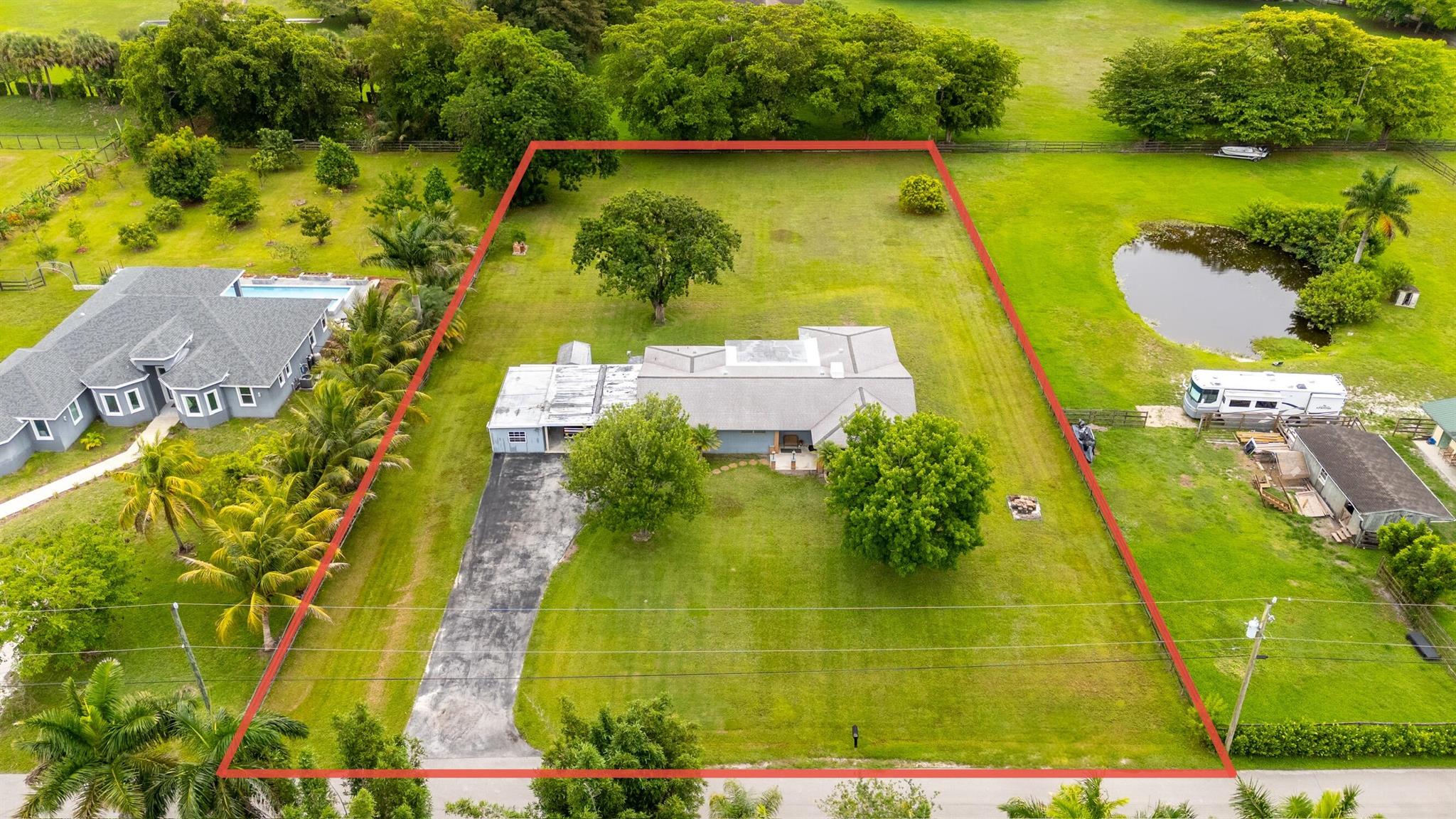 Public Auction to settle family estate. August 21st, 2025 1:30 PM. Appraisal for estate settlement and legal purposes was $1.9 Million. The family wants it sold on August 21st, 2025. Opening bid is $500K. Only one opportunity in Southwest Ranches like this one. Buy. Bank. Build. Benefit. Renovate home or Rent property while planning your dream estate home. A VERY UNIQUE AUCTION OPPORTUNITY This exceptional estate lot in the highly coveted Southwest Ranches is being offered through a transparent, Public Pricing Auction process. This is an estate sale and a prestigious opportunity for serious buyers to secure a rare piece of South Florida paradise through a professionally managed and family-honoring process. This estate has been in the same family since 1973.