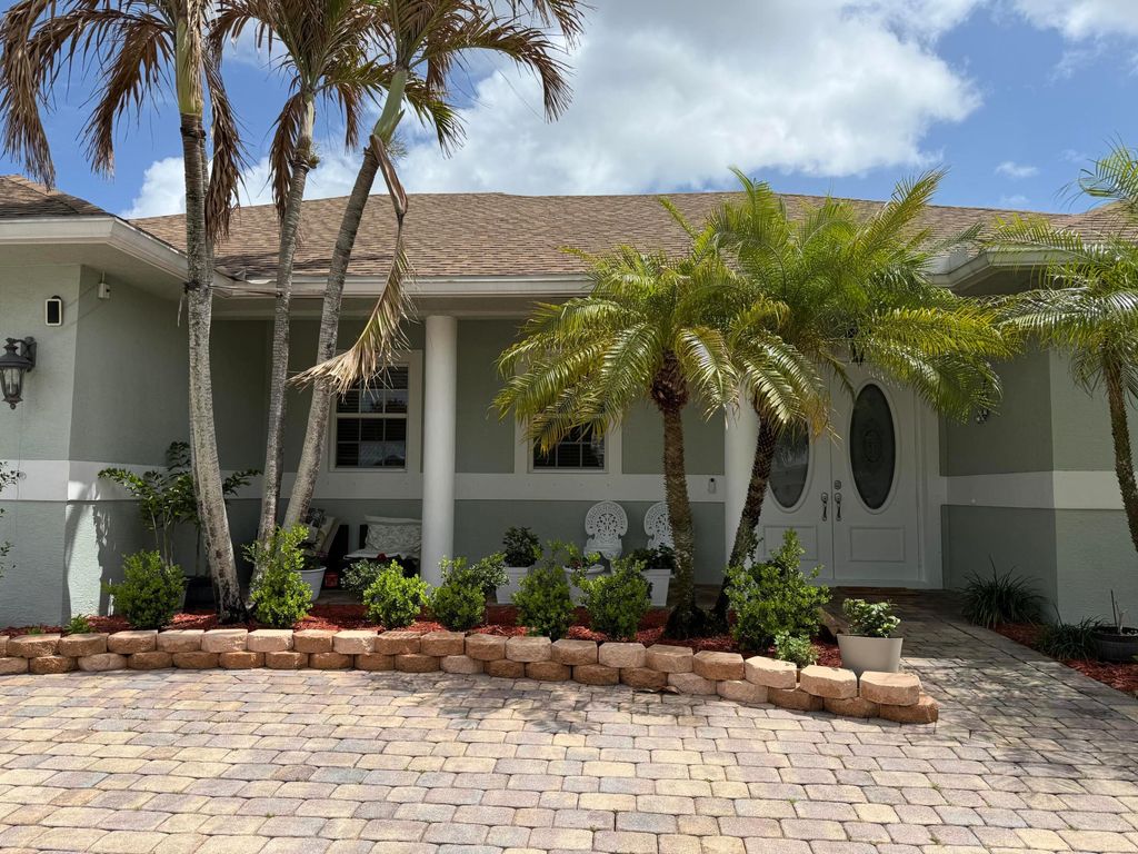 Photo of 2257 SW Lawrence Street, Port Saint Lucie, FL 34953 (MLS # B26008701)