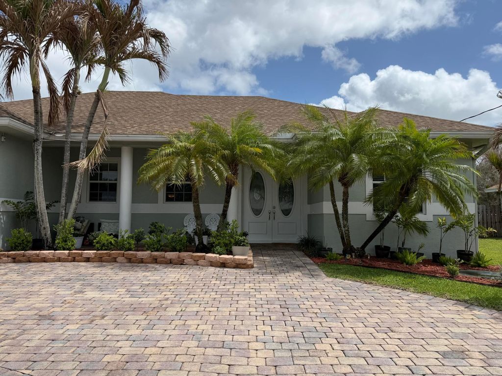 Photo of 2257 SW Lawrence Street, Port Saint Lucie, FL 34953 (MLS # B26008701)