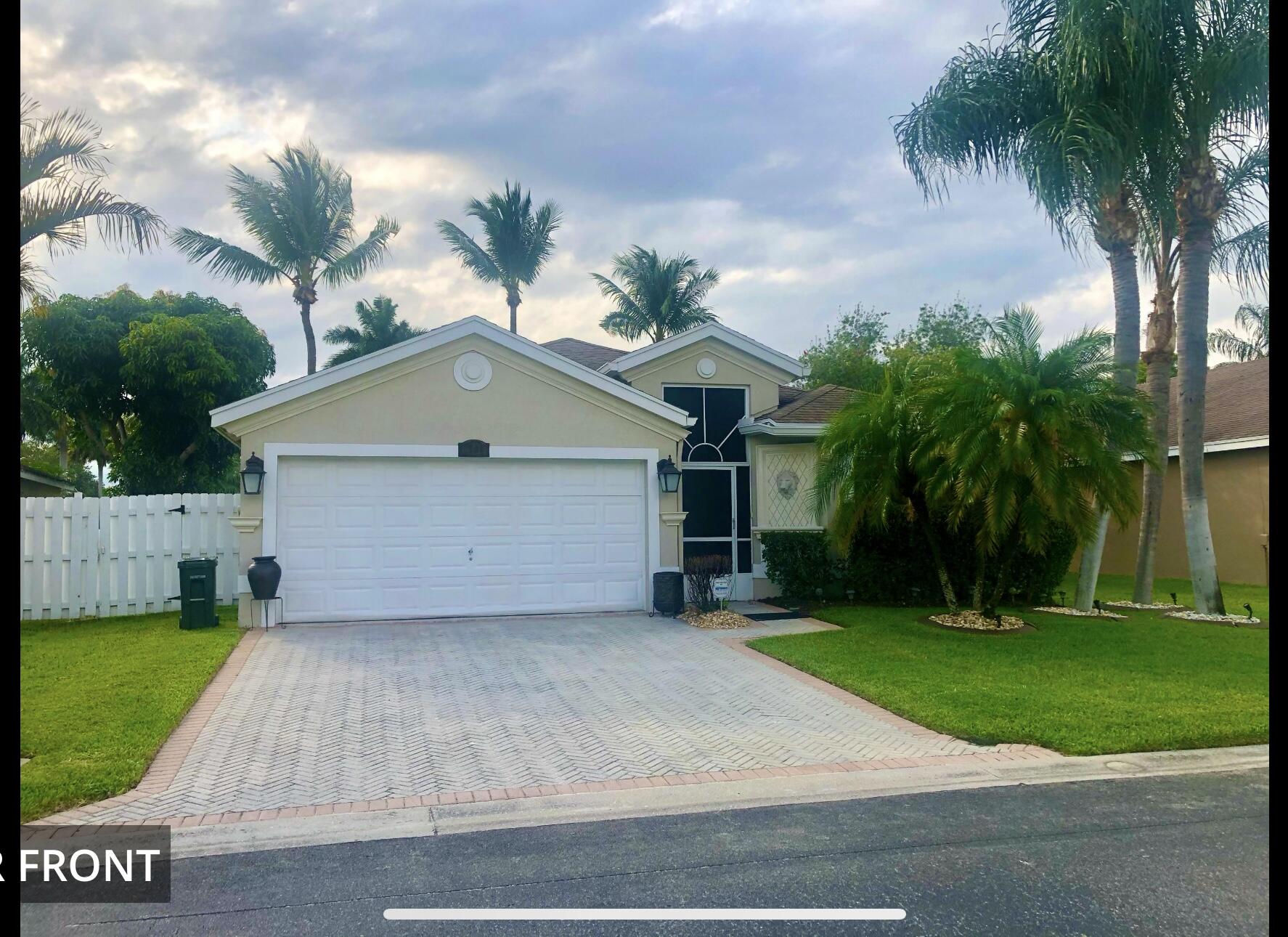 Beautiful 3 bedroom 2 bath home well maintained in the sought after gated community of Olive Tree the lowest Gated HOA fee. 24 Hour Man Gated close to all shops and ammenities such as minutes away from Wellington Green Mall, Publix, Walmart, pharmacies and Gym.