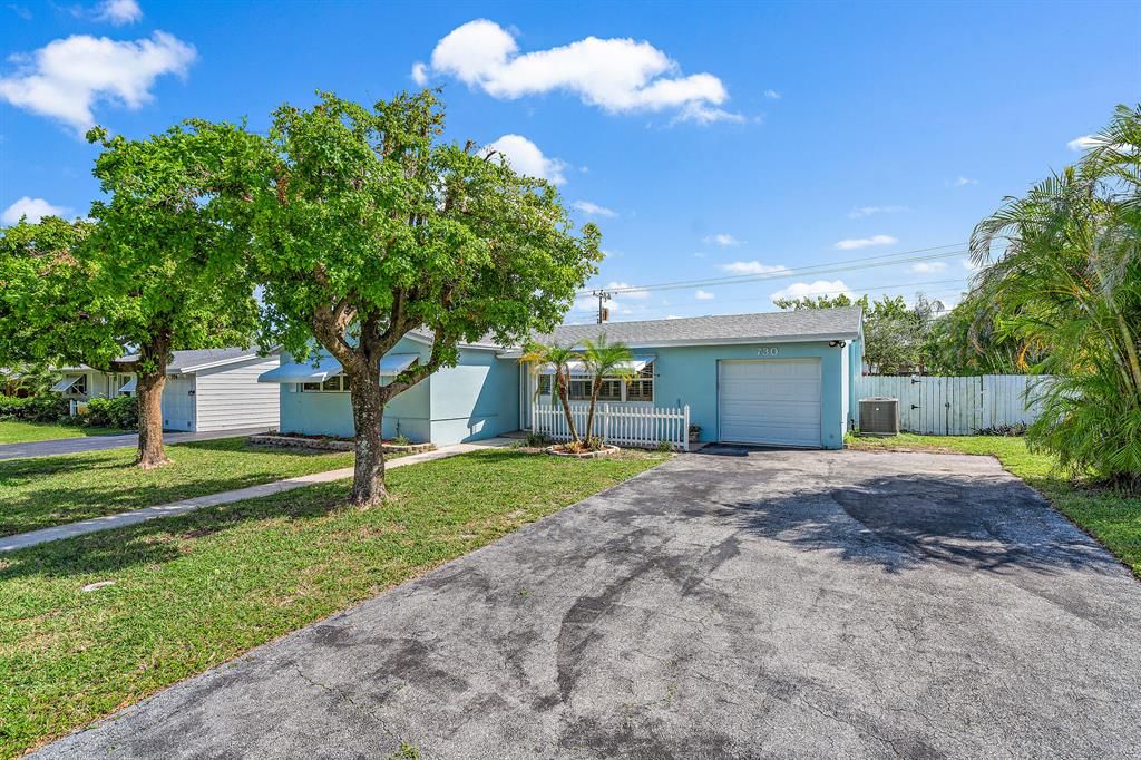 Photo of 730 W Jasmine Drive, Lake Park, FL 33403 (MLS # R10755600)