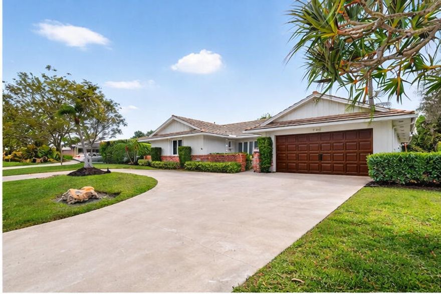 Charm & privacy await in the City of Atlantis w/no HOA in this beautifully updated 3 bed,2.5 bath home. The newly remodeled kitchen features sleek modern finishes, ideal for both everyday living & entertaining. Porcelain tile & laminate flooring flow throughout, while the primary suite offers a spa inspired bath w/a lux steam shower. French doors open to a covered lanai & newly tiled patio, creating seamless indoor-outdoor living. The fully fenced backyard is perfect for enjoying your private pool & the beauty of S. Fl.  Additional highlights include hurricane shutters throughout, an extra mini-split A/C system in the living room & one in the garage. Tons of storage & a huge circular driveway. Experience country club living without the equity! 24 Hr manned gate, our own city hall & police.