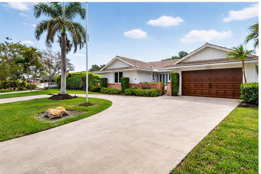 Photo of 229 Walton Heath Drive, Atlantis, FL 33462 (MLS # B26002462)