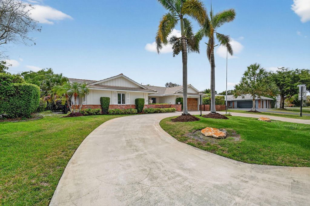 Photo of 229 Walton Heath Drive, Atlantis, FL 33462 (MLS # B26002462)