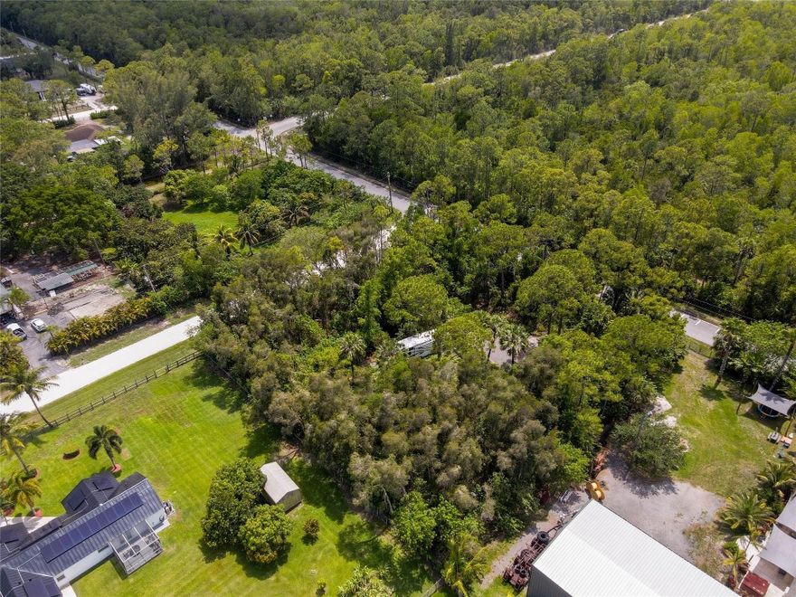 Build your dream home on this beautiful 1.34 acre corner lot in sought after Loxahatchee. This high and dry property sits on a quiet paved road and already features a culvert, swale, and asphalt milling road in place, offering convenient access and proper drainage.  The lot provides plenty of room for your custom home, pool, quest house, or workshop. Enjoy country-style living, with no HOA or restrictions- bring your boat, RV, and toys. Conveniently close to West Lake, major shopping, dining, and rated schools. Plus close to major highways for a quick commute. Lots like this are hard to find. Inquire today before it is gone. By Appointment call listing agent.