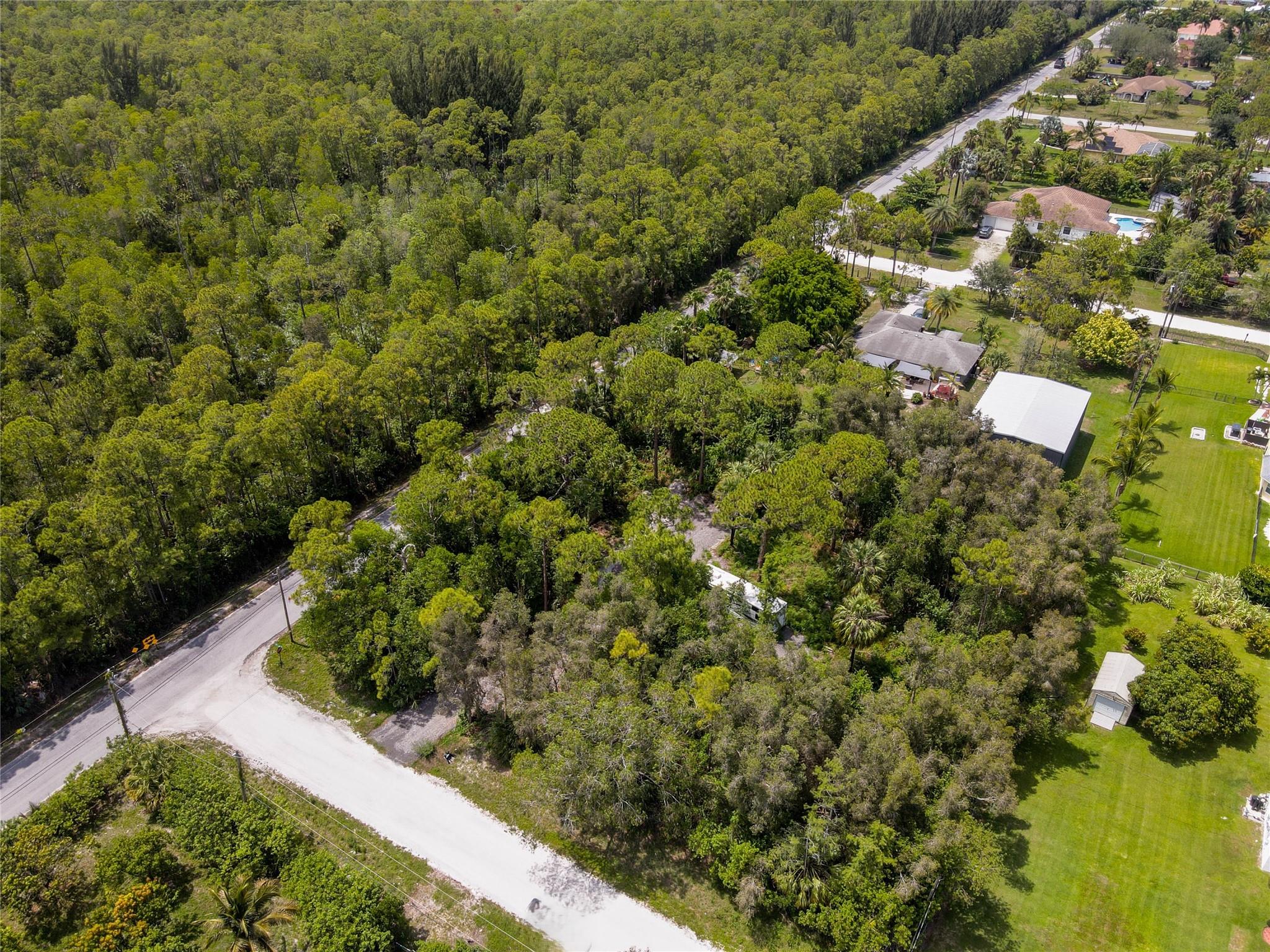 LOCATION LOCATION, No HOA, Sought after Corner Lot 1.34 acres large, with paved road access and newly gravel entry including majority newly graveled inside road that continues into lush perfectly cleared area, leaving mature tree lined coverage and privacy to build your dream home in this desirable and growing area near West Lake Village and new upcoming growth areas. Close to all your needs.
Ideal location minutes to Schools, Parks. Publix, and more. Easy commute, just 1 mile N of Southern Blvd allowing easy access to main roads and interstates. Fulfill your dream of being a land owner on this pristine large corner lot. Peaceful, Private and Serene, Ready to build. Last available lot on block, and premium corner to boot.
Own your piece of paradise. By Appointment call listing agent