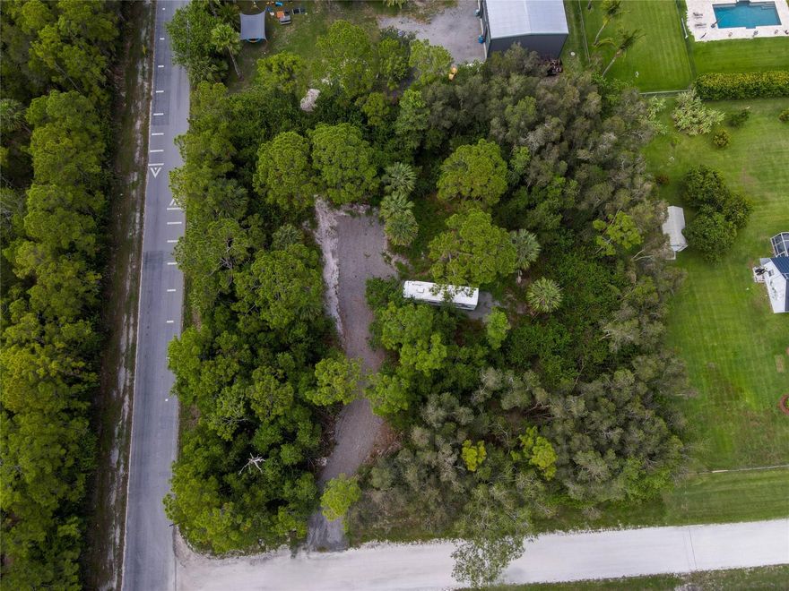Build your dream home on this beautiful 1.34 acre corner lot in sought after Loxahatchee. This high and dry property sits on a quiet paved road and already features a culvert, swale, and asphalt milling road in place, offering convenient access and proper drainage.  The lot provides plenty of room for your custom home, pool, quest house, or workshop. Enjoy country-style living, with no HOA or restrictions- bring your boat, RV, and toys. Conveniently close to West Lake, major shopping, dining, and rated schools. Plus close to major highways for a quick commute. Lots like this are hard to find. 
Inquire today before it is gone. By Appointment call listing agent.