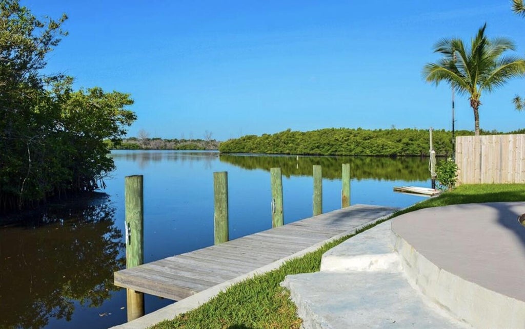 Photo of 70 SW Hideaway Place, Stuart, FL 34994 (MLS # R11027877)