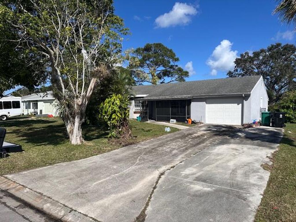 Photo of 2055 SE Triumph Road, Port Saint Lucie, FL 34952 (MLS # R10954415)