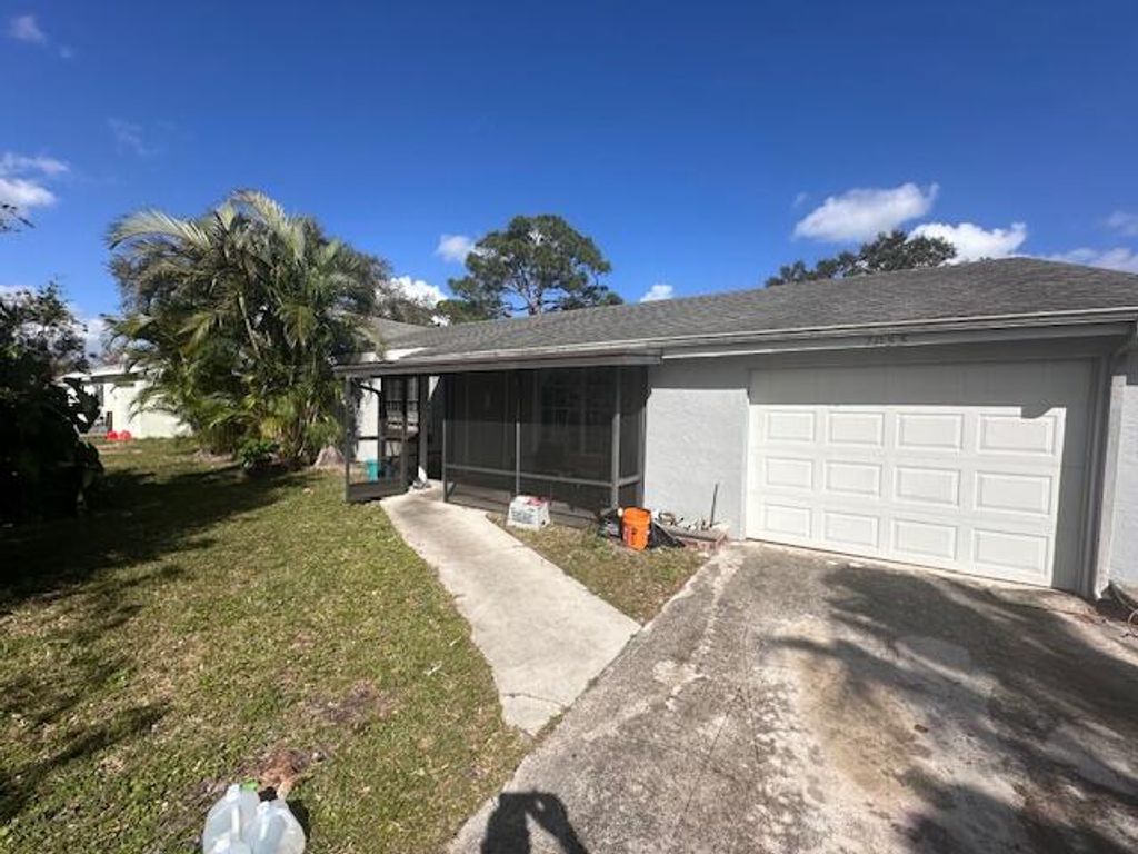 Photo of 2055 SE Triumph Road, Port Saint Lucie, FL 34952 (MLS # R10954415)