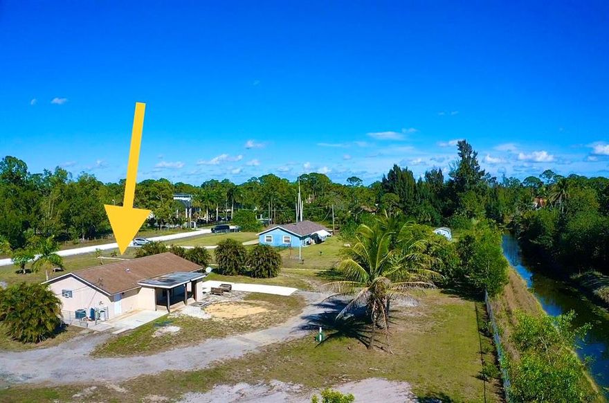 LOCATION ! LOCATION ! LOCATION ****NO HOA **. 1.28 ACRES *** CBS CONSTRUCTION *** WELL MAINTAINED 4 BEDROOM 2 BATHROOM HOME PLUS 50 AMP HOOK UP FOR RV PLUS RV PAD !!! IN LOXAHATCHEE *** NEW RENOVATED MASTER SUITE ***. UPDATED KITCHEN WITH STAINLESS APPLIANCES *** EXCELLENT HOME FOR ANYONE NEEDING LOT OF LAND SPACE WITH LONG DRIVEWAY TO BACK OF HOUSE. FULLY FENCED *** COVERED BACK PATIO FOR ENTERTAINING / BARBQ.  ***. MINUTES TO SHOPPING, SCHOOLS, GAS,
