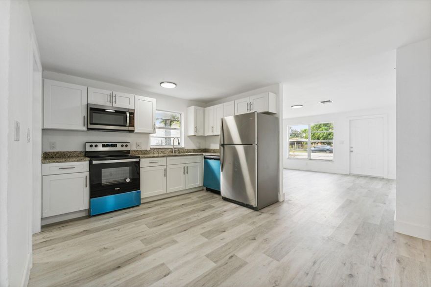 Step into this move-in-ready 4-bedroom, 2-bath residence that blends modern updates with an unbeatable location. Nestled east of I-95, the home offers quick access to the beach, top-rated shopping, dining, and major roadways. Recent upgrades include sleek vinyl plank flooring, contemporary stainless steel appliances, a brand-new A/C system, and a new washer and dryer. Bright, refreshed, and thoughtfully updated throughout, this home is ready for its next chapter. Don't miss the chance to make it yours--schedule a private showing today.