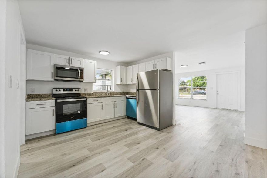 Step into this move-in-ready 4-bedroom, 2-bath residence that blends modern updates with an unbeatable location. Nestled east of I-95, the home offers quick access to the beach, top-rated shopping, dining, and major roadways. Recent upgrades include sleek vinyl plank flooring, contemporary stainless steel appliances, a brand-new A/C system, and a new washer and dryer. Bright, refreshed, and thoughtfully updated throughout, this home is ready for its next chapter. Don't miss the chance to make it yours—schedule a private showing today.