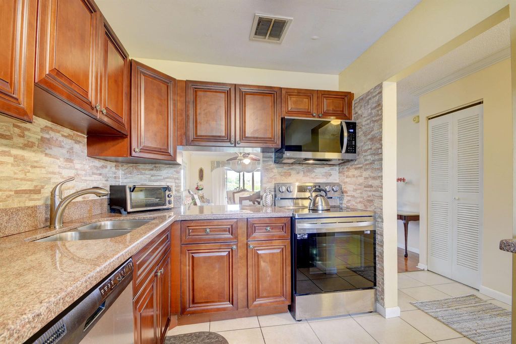 Photo of 219 Lake Meryl Drive, West Palm Beach, FL 33411 (MLS # R10913135)