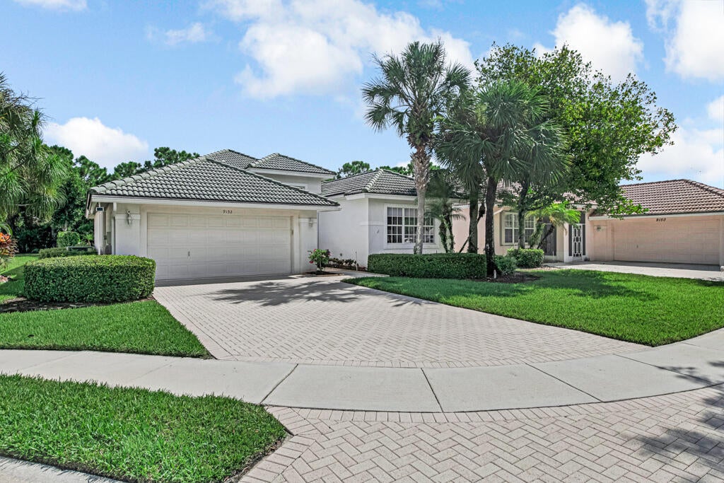 Photo of 9152 Bay Harbour Circle, West Palm Beach, FL 33411 (MLS # B26070220)