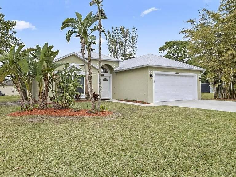 Photo of 2218 SE SEAMIST Street, Port Saint Lucie, FL 34952 (MLS # B26057698)
