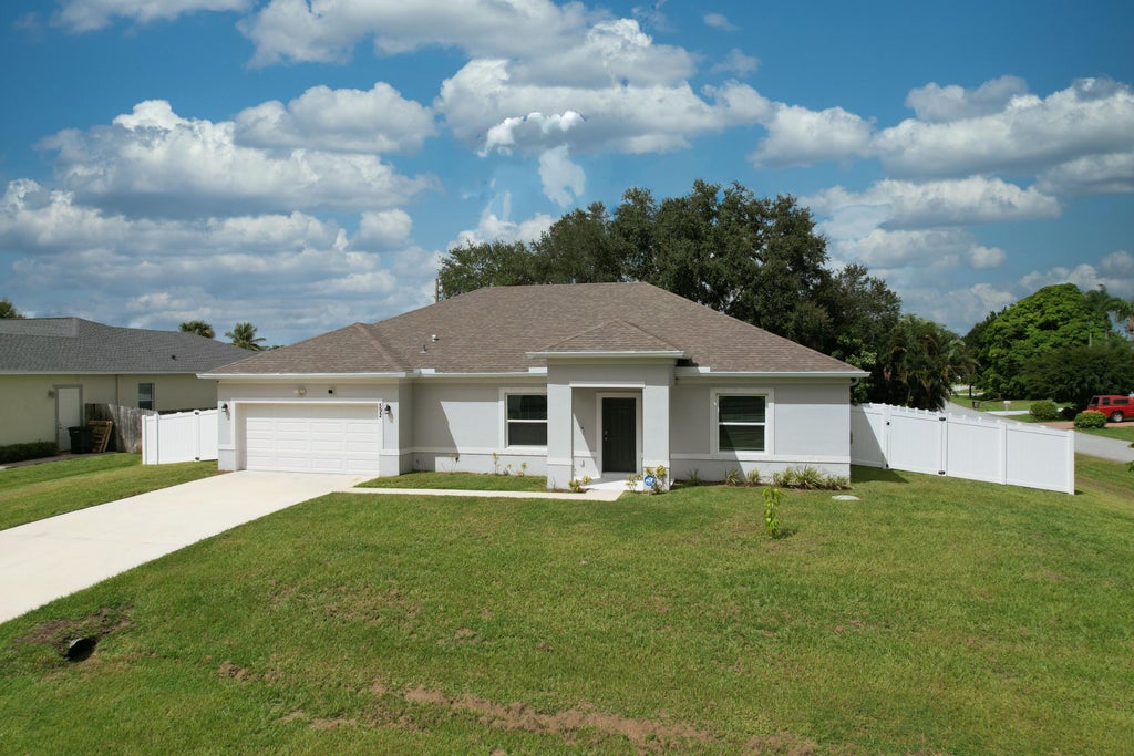 Photo of 592 SW Dauphin Avenue, Port Saint Lucie, FL 34953 (MLS # B26060844)