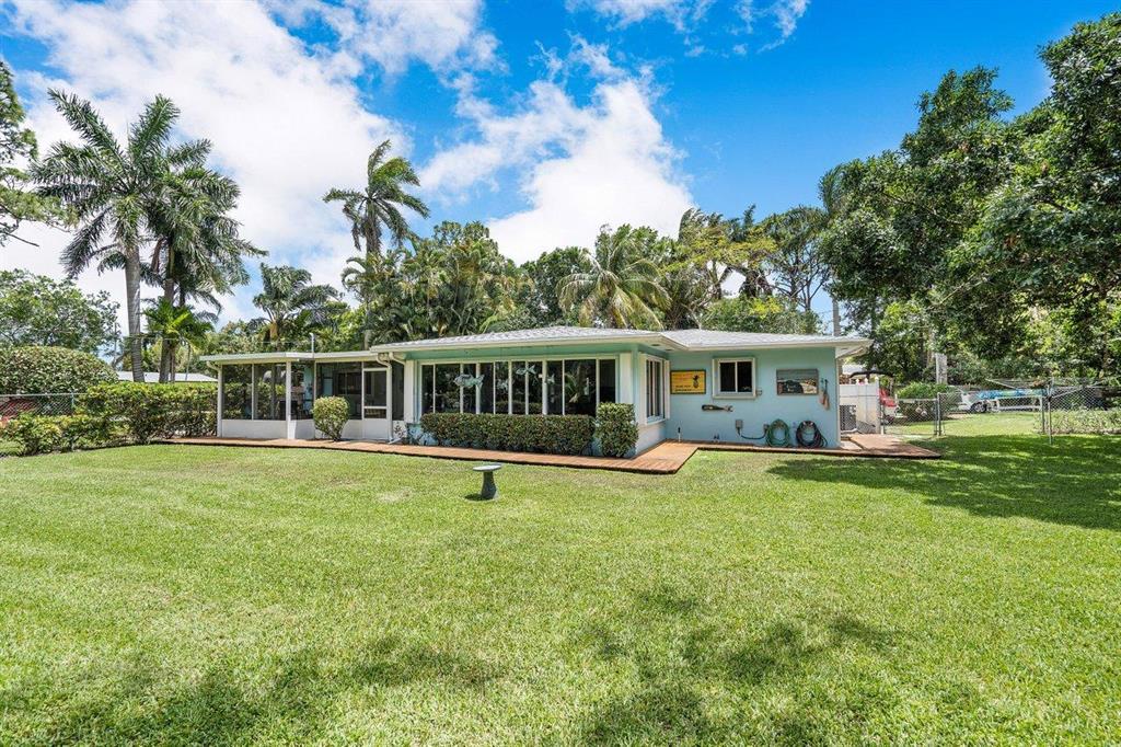Total Hidden Gem! Nestled at the end of a private road in the heart of Jupiter. This fully renovated 3bed/2bath CBS home is situated on over 1/2 ACRE lot with NO HOA. Gorgeous upgrades including a bright and airy custom kitchen, completely renovated bathrooms, Wide Plank Quick-Step flooring throughout, smooth finish ceilings, and much more! Step into the light and bright entryway that leads to the spacious living area. The home has plenty of natural light with large windows throughout. The kitchen features custom crisp white soft-close cabinetry, Everform solid surface countertops, and a fabulous oversized stainless single basin sink. The renovated kitchen flows into the open dining space to the family room with expansive views of the backyard oasis. {CLICK MORE}