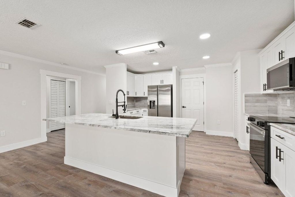 Photo of 1075 SW Fenway Road, Port Saint Lucie, FL 34953 (MLS # R11024597)