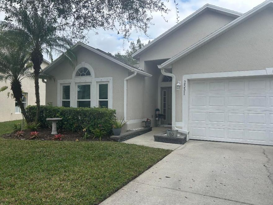 Meticulously maintained Majestic Oaks 3 bd/2 bath home on a private outside corner lot with greenery and future lake view. 2025 roof & 2022 impact windows, offer transferable warranties. AC 2021. Gorgeous, laminate wood flooring with open concept, large kitchen Island, Coffee bar, and beverage cooler complete the design! The master bedroom offers an updated tile shower and walk-in closet. Water filtration, can lighting on the lanai, gutters and downspouts 2021! Salt water community pool is heated.