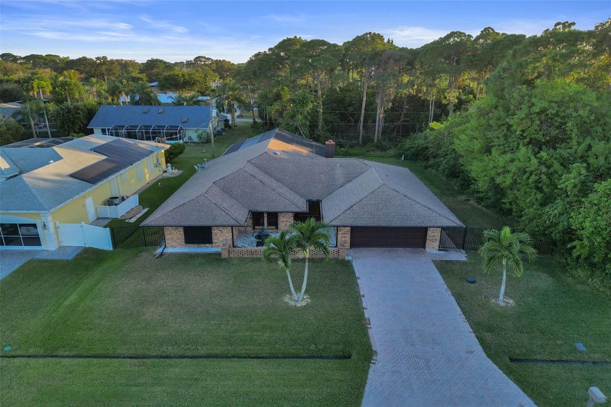 This is a single-family home with great curb appeal and an included vacant lot next door, which can be sold together for $610,000, bringing the total lot size to 20,000 sq ft or almost a half-acre.