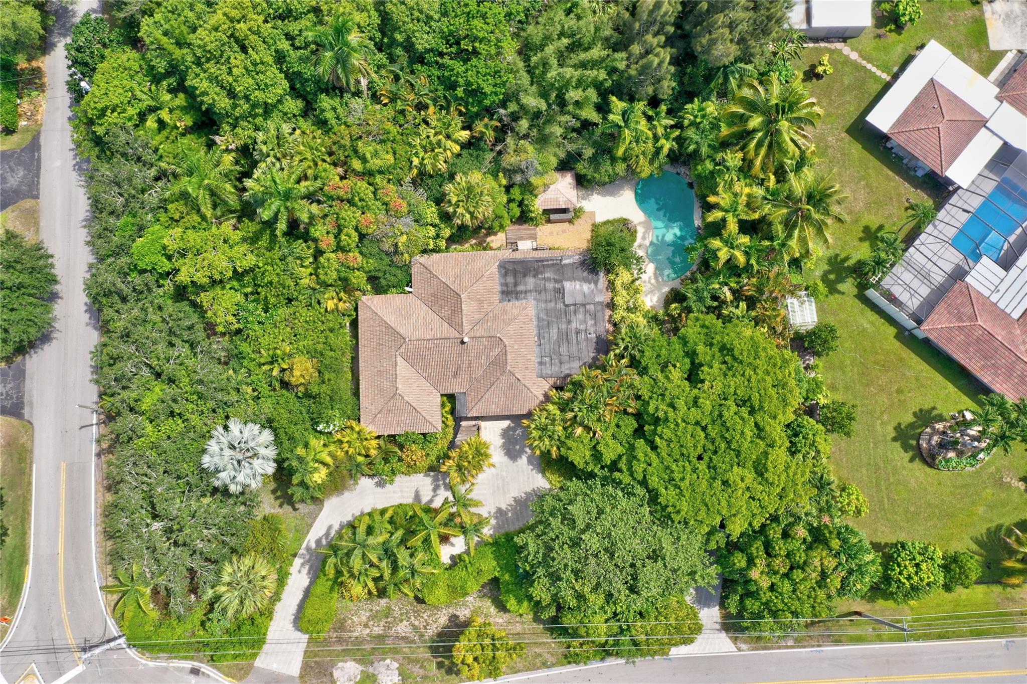 Custom-built home brimming with Old Florida charm! This unique home features 3 spacious bedrooms, 3 full bathrooms, and an additional versatile room off the primary suite—ideal for a home office, nursery, creative studio or 4th bedroom. Once owned by a sculptor, artistic touches and custom features are found throughout the home, making it truly one-of-a-kind. Enjoy your private pool, full hurricane protection, and a peaceful setting in one of the area’s most desirable historic neighborhoods. Situated on an expansive 34,000+ square foot lot, this special property offers endless possibilities—whether you're dreaming of an addition, space for an RV or boat, or simply more room to enjoy. Centrally located near major highways and downtown Ft. Lauderdale, community tennis courts, park & library.