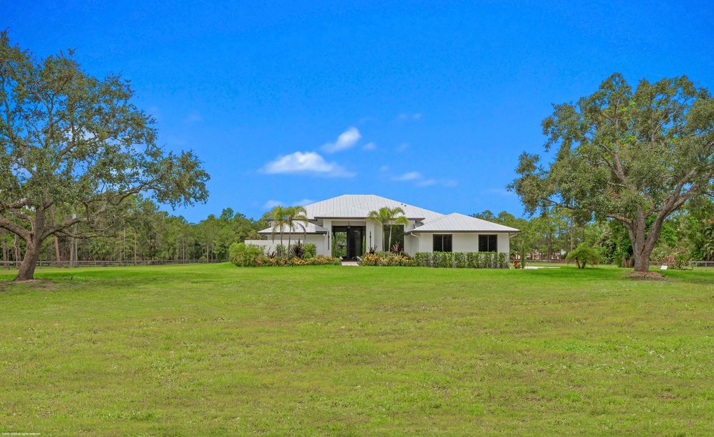 Photo of 5555 Cougars Prowl, Lake Worth, FL 33449 (MLS # R11049161)
