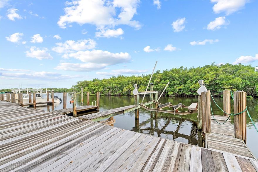 CALLING ALL BOATERS!  Don't miss this turnkey condo with unrestricted ocean access (no bridges!) and a deeded slip accommodating up to a 40ft vessel.   This charming move-in ready home has been completely renovated with new LVP flooring, updated baths, new appliances, and freshly painted throughout.  Light and bright!  W/D hookups in master walk-in closet. Conveniently located on the first floor. The community includes a sparkling pool, renovated clubhouse, tennis and pickleball courts, boat trailer parking, and laundry facilities. Step outside your covered screened patio to your dock, jump in your boat, and you are minutes from the Atlantic as well as amazing waterfront restaurants.  Sought-after East location within walking distance to beach, night life, houses of worship, and dining