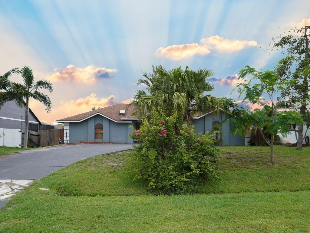 Photo of 925 SE Streamlet Avenue, Port Saint Lucie, FL 34983 (MLS # R10995608)