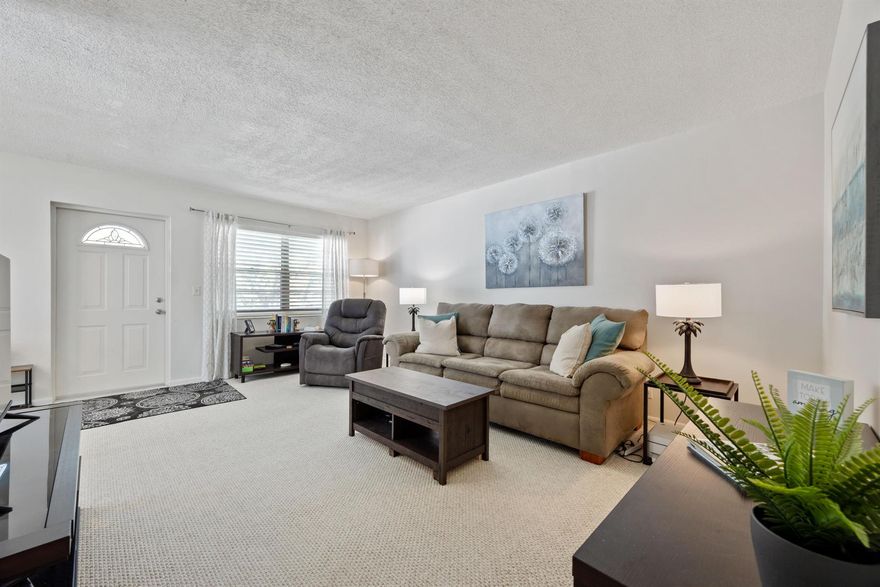 Charming CORNER 2nd floor 2 bedroom, 1 1/2 bath sold TURNKEY and move-in ready! Super clean, lots of light, beautifully decorated and lovingly maintained. Central air, new water heater 2024, air handler 2024. Pretty garden view from your long screened lanai and lots of privacy.  New roof 2024 and building soon to be repainted. Within walking distance to Hastings pool and fitness center. Century Village is a 55+ gated community with 12 pools, large Clubhouse with theater, shows, movies, fitness center, tennis, racquet ball, courtesy bus and tons of activities!