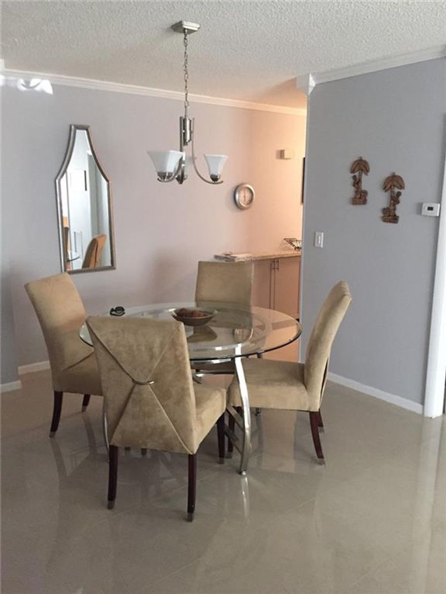 HURRY THIS WILL NOT LAST!!!! RARE DESIRABLE CORNER UNIT  .  GRANITE COUNTER TOP AND SIDE BAR. TILE AND WOOD FLOORS RENOVATED . THE FURNITURE CAN BE PURCHASED.   AN OASIS IN AN URBAN SETTING . WELL MAINTAINED COMPLEX,. 55+ , CLOSE TO WILTON MANORS, RESTURANTS,SHOPS,I-95 PEACEFUL AND QUIET !!! SELLER IS FIRM ON ASKING PRICE.