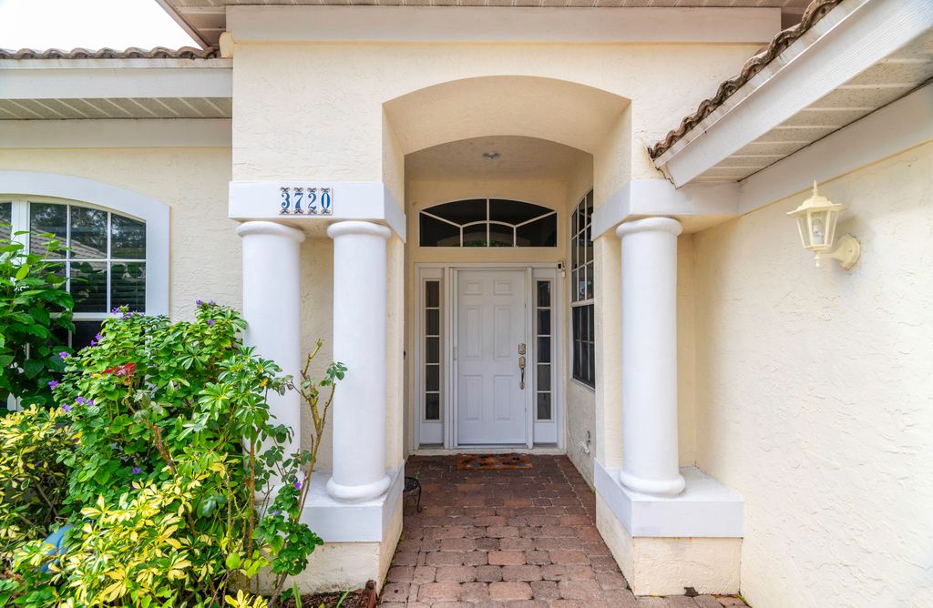 Photo of 3720 NW Royal Oak Drive, Jensen Beach, FL 34957 (MLS # R10937095)
