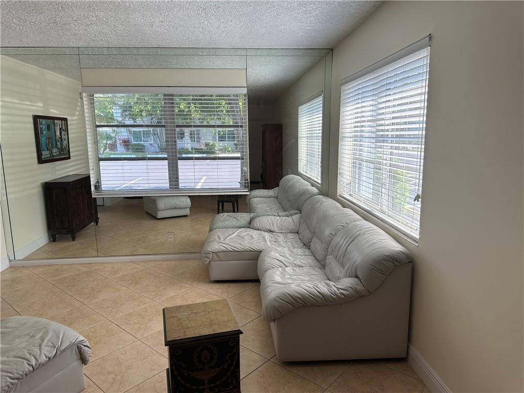 LOCATION! LOCATION! LOCATION! RARE CORNER UNIT ,1ST FLOOR, PARKING SPACE IN FRONT OF UNIT, TILE FLOOR THROUGHOUT. RENOVATED. OASIS IN URBAN SETTING. CLOSE TO RESTURANTS, PUBLIX, NIGHT LIFE IN WILTON MANORS, CLOSE TO I-95. BEAUTIFULLY MAINTAINED COMPLEX. MUST OWN 2 YEARS BEFORE LEASING, "AS IS' NO CONTINGENCIES AFTER INSPECTION- 20% DOWN REQIURED CALL LISTING AGENT FOR SHOWING INSTRUCTIONS