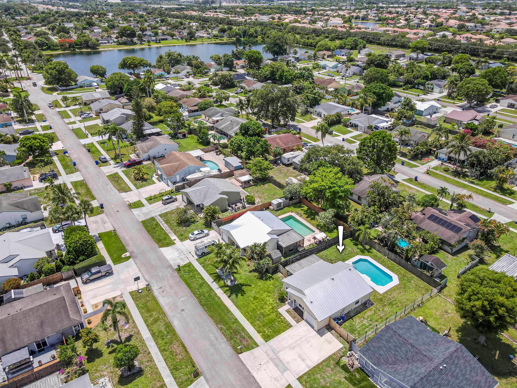 This updated, move-in ready 3-bedroom home in Counterpoint Estates offers charm, comfort, and a private backyard oasis. Featuring an updated kitchen with white cabinetry, stylish backsplash, and vaulted wood-paneled ceilings, plus real wood floors throughout. The bathroom is oversized and newly renovated with elegant tile work and a clean, modern finish. Enjoy the screened-in and covered patio, a private in-ground pool, and a generously sized backyard with green space for kids or pets. A 2016 roof, massive driveway, and one-car garage add to the value and functionality. Located in a quiet, family-friendly community with three parks, walking trails, and lakes with a shared dock, ready for your personal touch, this is a rare find with incredible curb appeal potential. No HOA!
