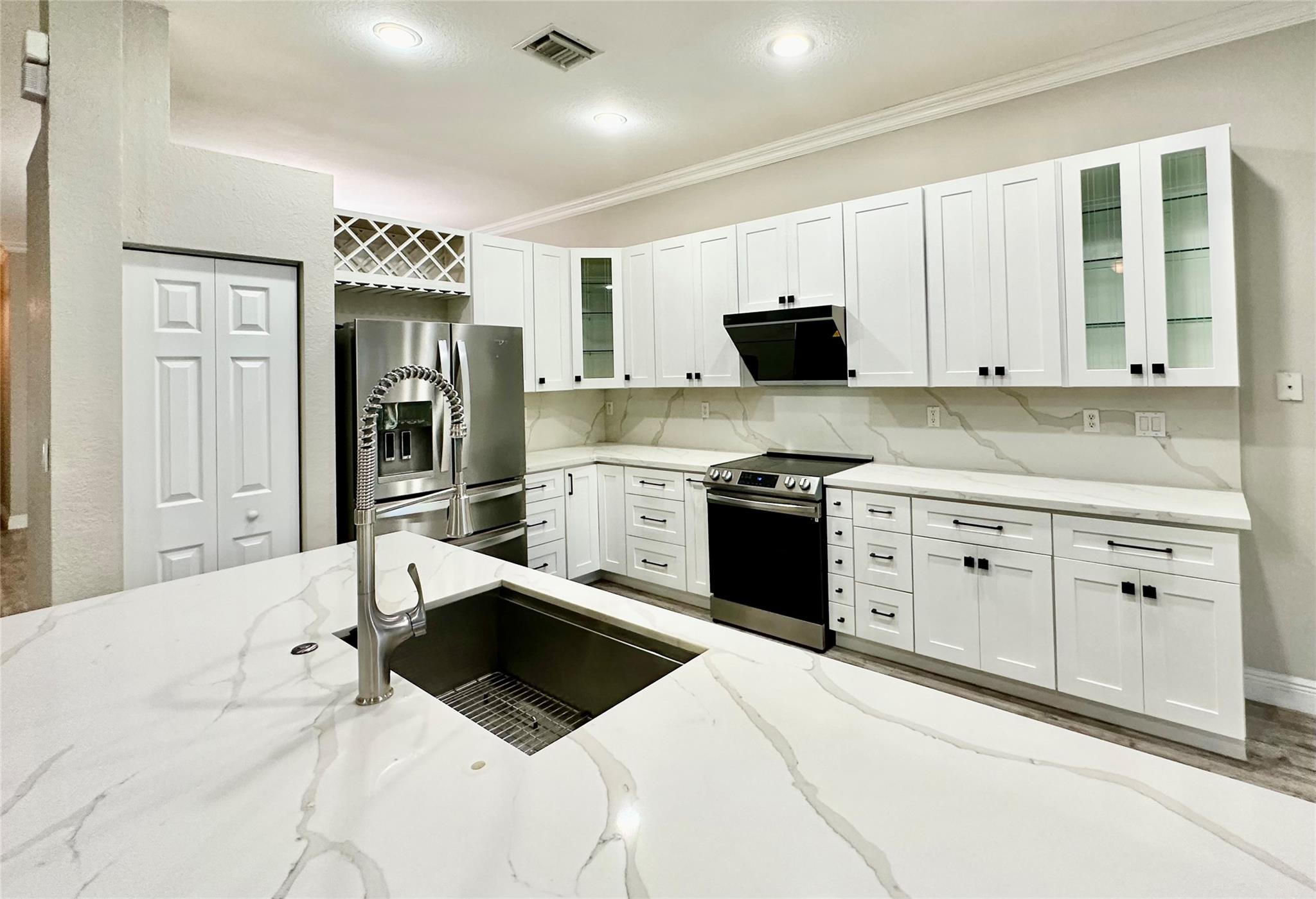 Impeccably Maintained, 1-Story, 4-bedroom Single Family House in the Prestigious Isles at Weston, Renovated Kitchen w/ White Quartz Countertop, Stainless Appliances (2021), Vent-out Range-hood, White Cabinets, Bright Breakfast Area, Washer & Dryer (2022), Laminate Floor throughout, Roomy Living Space w/ Plantation Shutters, Formal Dining, Basic Cable TV & WiFi included, Covered Patio, Hurricane Shutters, 24-hours Guarded Gate, Community Pool, Gym, Clubhouse, and Playground, Preferable Cypress Bay High, Falcon Middle and Manatee Bay Elementary, Close to Weston Common and Freeway, Quick HOA Approval, 1-2 weeks, Great Opportunity.