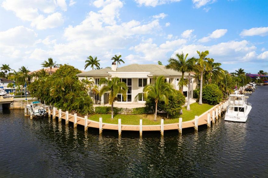 Trophy gated point lot estate encompassing 223 feet of deep water frontage on one of the rare island streets of Lighthouse Point. This unique estate home has 3 master bedrooms with ensuite bathrooms. This home distinguishes itself from any of the homes on the market. In addition to the 5 bedrooms, there is an office on the second floor, in addition to a small media room off the master bedroom. Impeccably maintained with crown moldings, coffer ceilings, marble floors and oversized rooms throughout. The southwest facing tropical pool guarantees sun throughout the year. No fixed bridges.Ocean access.