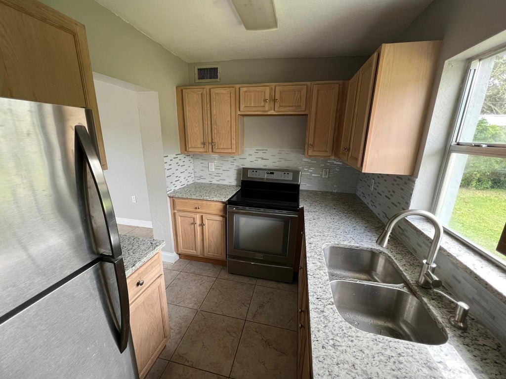 Photo of 1883 Breezy Lane, West Palm Beach, FL 33417 (MLS # B26028253)