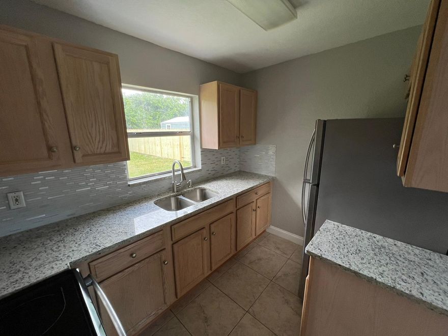 Beautiful Renovated 2/2, W/ all Utilities & Lawn Included!, New kitchen with Granite Counters, Stainless Steel Appliances, Newer Bathrooms, all tiled, all fenced, great Backyard, UTILITIES Payment Extra $200. (Water, Electric & Landscape), great Location, Close to the Beach and restaurants!