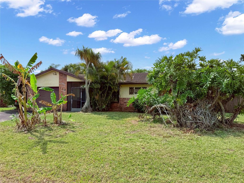 Photo of 118 SW Lancaster Avenue, Port Saint Lucie, FL 34984 (MLS # F10498967)