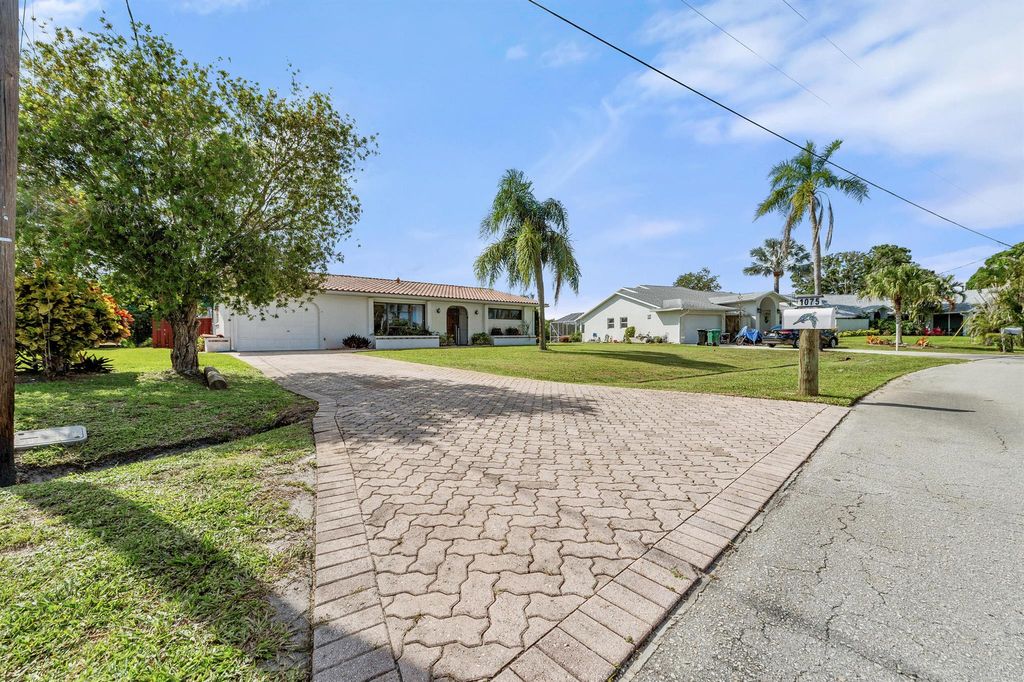 Photo of 1075 SE Coral Reef Street, Port Saint Lucie, FL 34983 (MLS # R11106773)