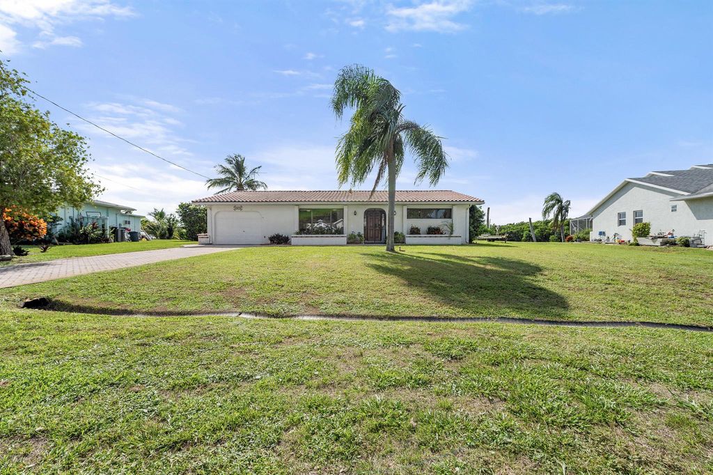 Photo of 1075 SE Coral Reef Street, Port Saint Lucie, FL 34983 (MLS # R11106773)