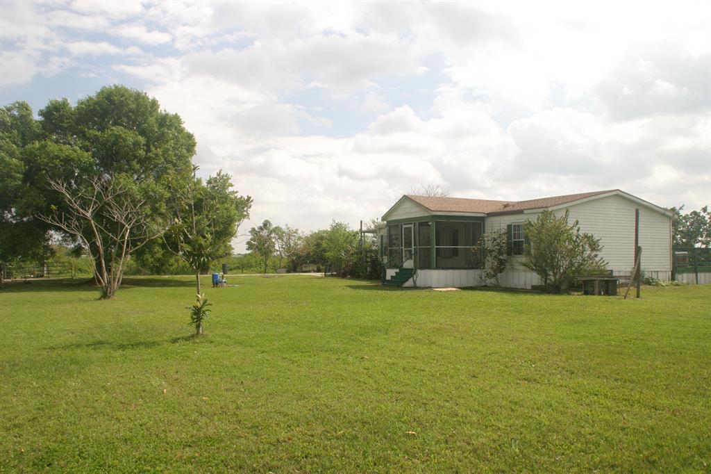 8.24 Acres of fenced and well kept land, ready for a new owner. Includes a 3 bedroom 2 bathroom Mobil home (1,296 sq ft) with new AC New roof, new water pomp, water heater, and a garage/workshop. Nice matured fruit trees, Quiet and relaxing environment. if you like animals there are 9 Cows, 1 Bull and 1 calf. (2 pregnant cows)