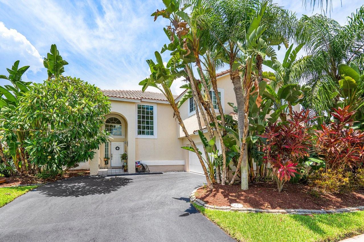 Welcome to Weston's best priced home! This spacious, sun drenched house has tons of potential for the buyer who does not mind a few projects. The well distributed floor plan gives you plenty of options for living arrangements with tons of windows overlooking the pool area & letting in tons of natural light. Upstairs you have a nice sized loft/work area along with all bedrooms and 2 full bathrooms. The kitchen features solid wood cabinetry, SS appliances and granite counters. Outside, a fully screened, huge pool area makes this an entertainer's dream. Beyond the screened area you still have plenty of grass space, all fully fenced and private. The home is located in the heart of Weston in a gated community with low HOA fees. 1 mile from Town Center and zoned for highly rated schools.