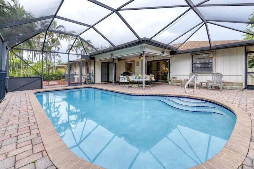 Photo of 2517 Canterbury Drive N, Riviera Beach, FL 33407 (MLS # R10884159)