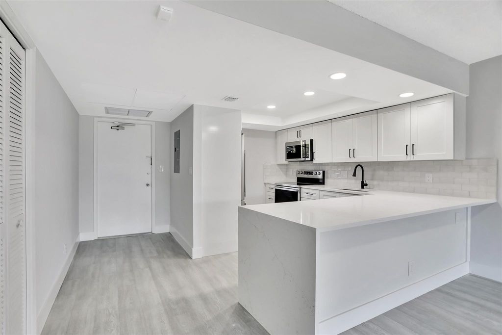 Photo of 575 Oaks Lane #307, Pompano Beach, FL 33069 (MLS # F10414363)