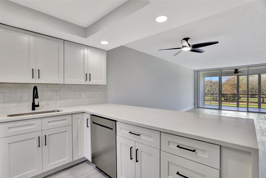 DRASTIC PRICE REDUCTION !!  Totally updated spacious 2 bed/2 bath unit on 3rd floor with gorgeous view of Golf Course.  Impact windows (excluding sliding doors). Owner has remodeled this space and opened it up to create an open floor plan.  All new kitchen appliances. Quartz waterfall countertops! New Flooring.  New bathrooms. Just bring your furniture ! Nicely done in neutral colors.  Washer/Dryer in unit.  Two beautiful community pools within walking distance of unit. 24 hour notice for all showings.  Spare the hassel of getting permits....all done and ready to move in.  All information deemed reliable, not guaranteed