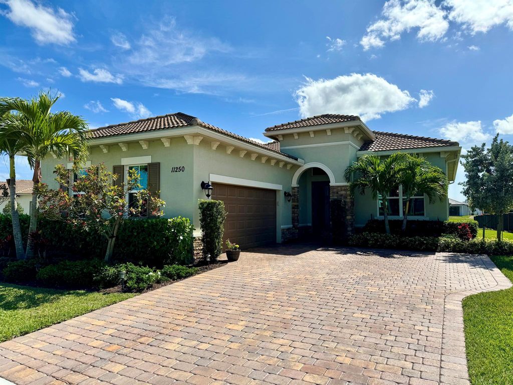 Photo of 11250 SW Lunata Way, Port St Lucie, FL 34987 (MLS # R10970212)